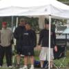 21-Players at field 4 standing under thier tent, attempting to stay dry